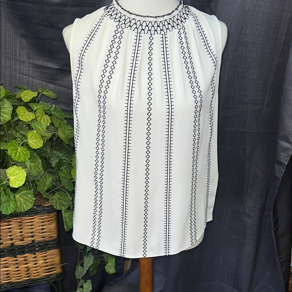 White Sleeveless Pleated Blouse with Black Detailing